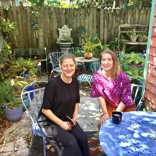 A Danish girl and a London girl enjoying the morning in the garden