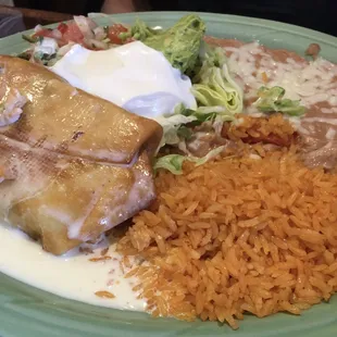 Chimichanga with refried beans and Spanish rice.