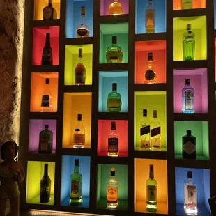 a colorful display of liquor bottles