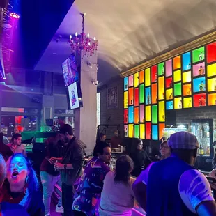 a crowd of people at a bar