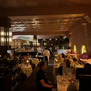 a restaurant with people sitting at tables