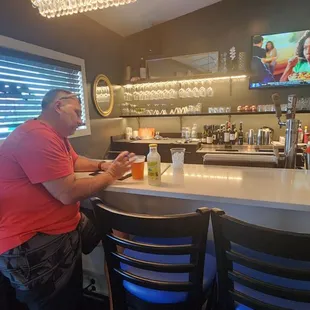 a man sitting at a bar