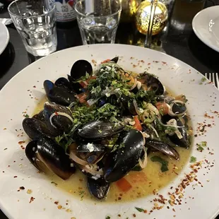 Mussels in white wine broth.