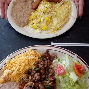 Steak Ranchero and Sausage with eggs and beans.