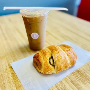 a cup of coffee and a pastry