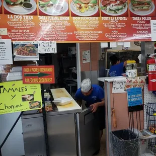 a man preparing food in a restaurant