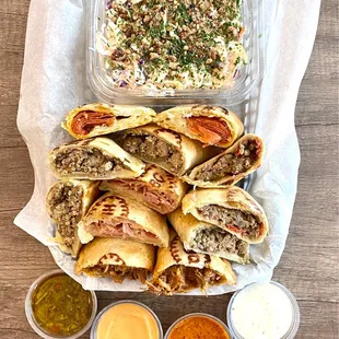 Filled Beef Empanada, Humita Empanada, Ham, Bacon &amp; Cheese Empanada, BBQ Pulled Pork Empanada on