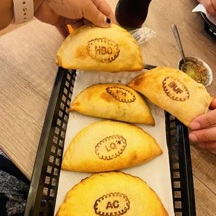 Ham, Bacon &amp; Cheese Empanada Philly Cheesesteak Empanada *NEW* Buffalo Chicken Empanada Leche Quemada Empanada Apple Cinnamon Empanada