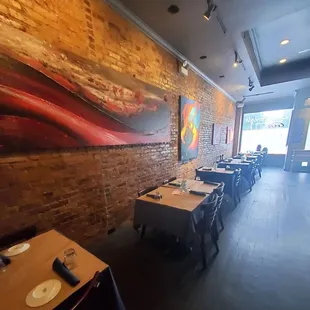 a dining room with tables and chairs