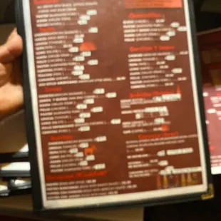 a person holding a menu