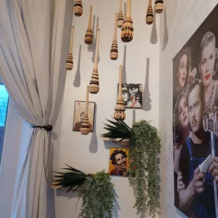 a bunch of hanging objects on a wall