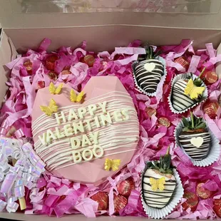 Valentines smash heart filled with candy and chocolate strawberries