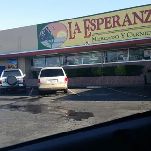 cars parked in front of a restaurant