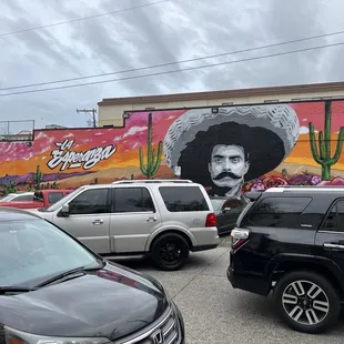 a mural of a man with a mustache