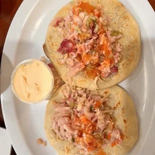 Pupusas revueltas with a side of salvadorian creme