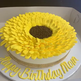 a sunflower on a birthday cake