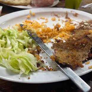 Milanesa after devouring other 2 big pieces .