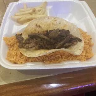 Beef Taco labeled "Taco Texanos", Mexican rice, and some fries.