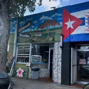 a car parked in front of a restaurant