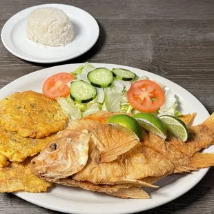 a plate of fried fish and vegetables
