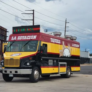 a taqueria truck parked on the side of the road