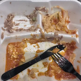 Completely finished cheese enchiladas with a side of rice and beans