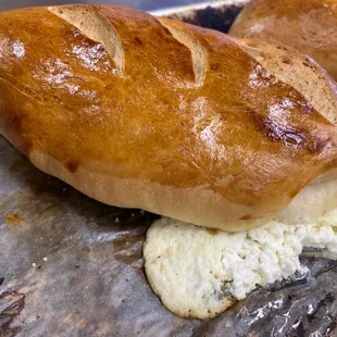 a loaf of bread with a bite taken out of it