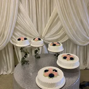 a table with three cakes on it