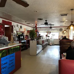 a man sitting at a table in a restaurant