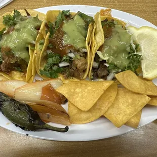 2 barbacoa tacos and 1 asada taco