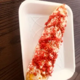 Corn on the cob with hot cheetos