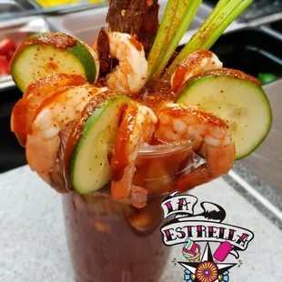 "CLAMARONAZO"
Clamato juice,cucumber,peanuts,shrimp, celery and beef jerky