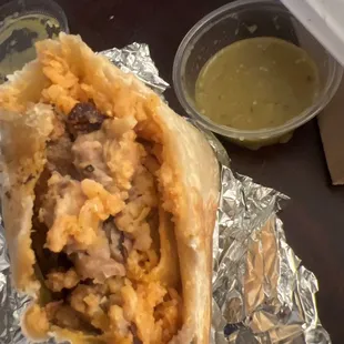 Pastor burrito and green salsa