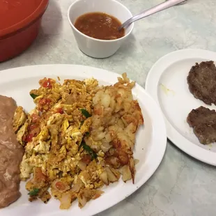 Migas a la mexicana plate with sausage added