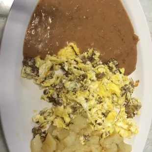 Sausage and eggs plate with potatoes added