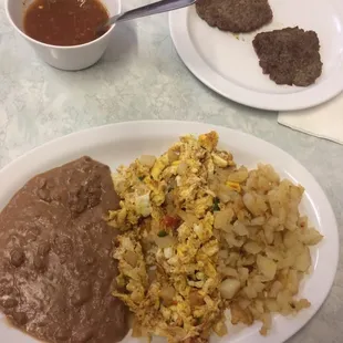 Heavos a la mexicana plate with breakfast sausage added