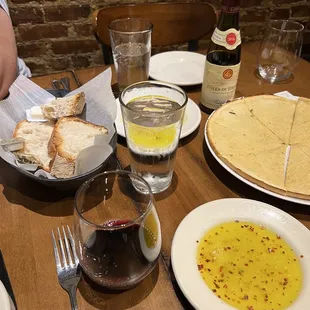 a table full of food and wine
