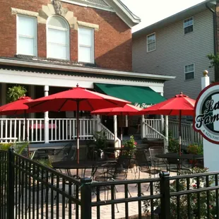 a really posh outdoor dining area and professional sign uncharacteristic of most huntington restos