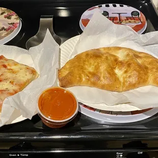 Slice of Sicilian, small cheese calzone, November 2020.