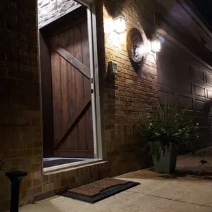 The Cellar @ La Famiglia Winery&apos;s Entrance at night with the door open