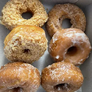 2 toasted coconuts, 1 glazed cake, 1 cinnamon sour cream, and 2 glazed apple cake donuts