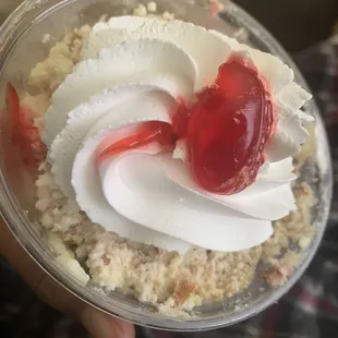 a dessert in a plastic cup