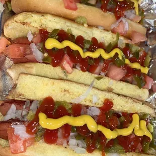 Mexican Hotdog comes with mayo, tomatoes, onions, jalapeños, ketchup and mustard!