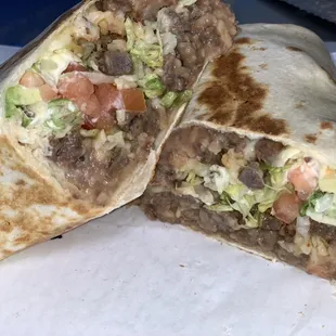 Steak Burrito comes with beans, rice, cheese, avocado, lettuce, tomatoes and sour cream!