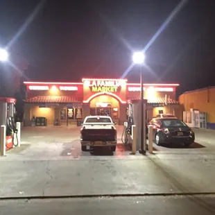  cars parked at a gas station