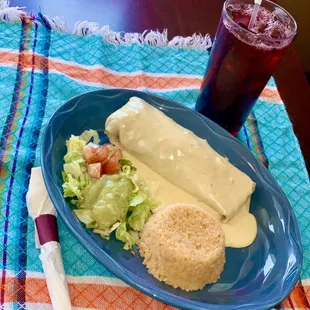 California Burrito- Shredded pork or grilled chicken cooked with grilled onions and peppers. Served with rice and guacamole salad