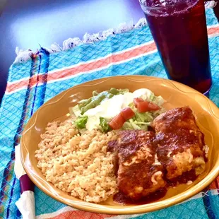 Valentina-Two Chicken chimichangas served with rice and guacamole salad and sour cream