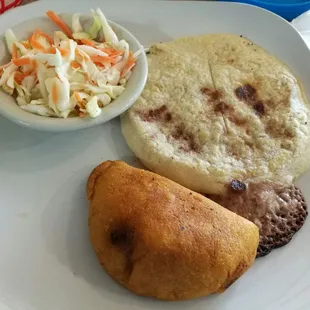 Incredible pupusas and empanadas. I asked for the most popular ones so not sure what the names are on the menu.