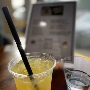 a drink in a plastic cup with a straw