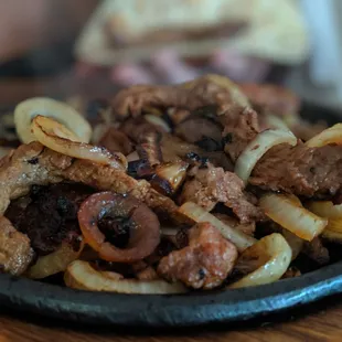 Beef fajitas for one with delicious caramelized onions.